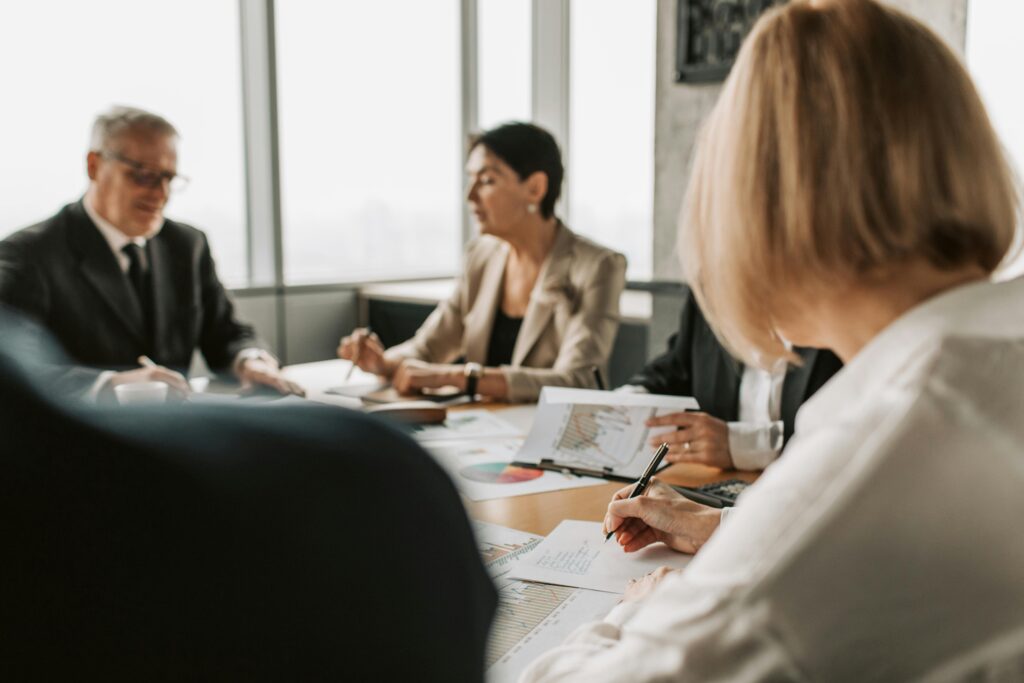 Image of people in a meeting for the blog How Do You Transition a Family Business Without Creating Winners and Losers?