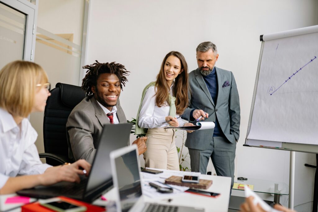image of a group of business people for the blog How the Objectives Matrix™️ Helps Business Owners Discover Purpose Beyond the Business