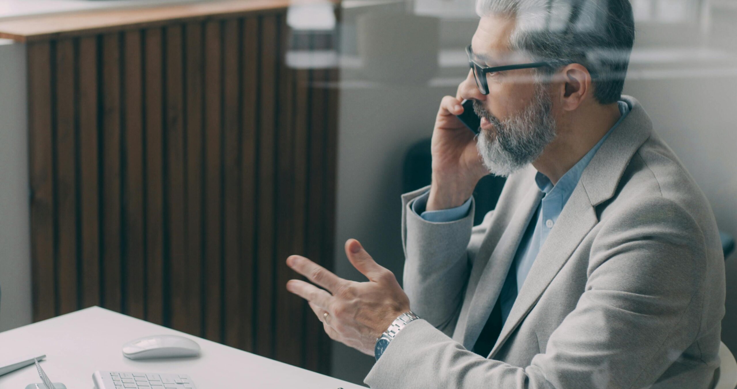 Image of an old business man talking on the phone for the blog Are You Really Ready to Let Go?
