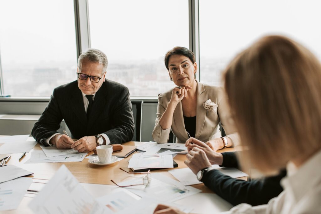 People in a business meeting for the blog: When Leadership Doesn’t Fit Like a Hand-Me-Down