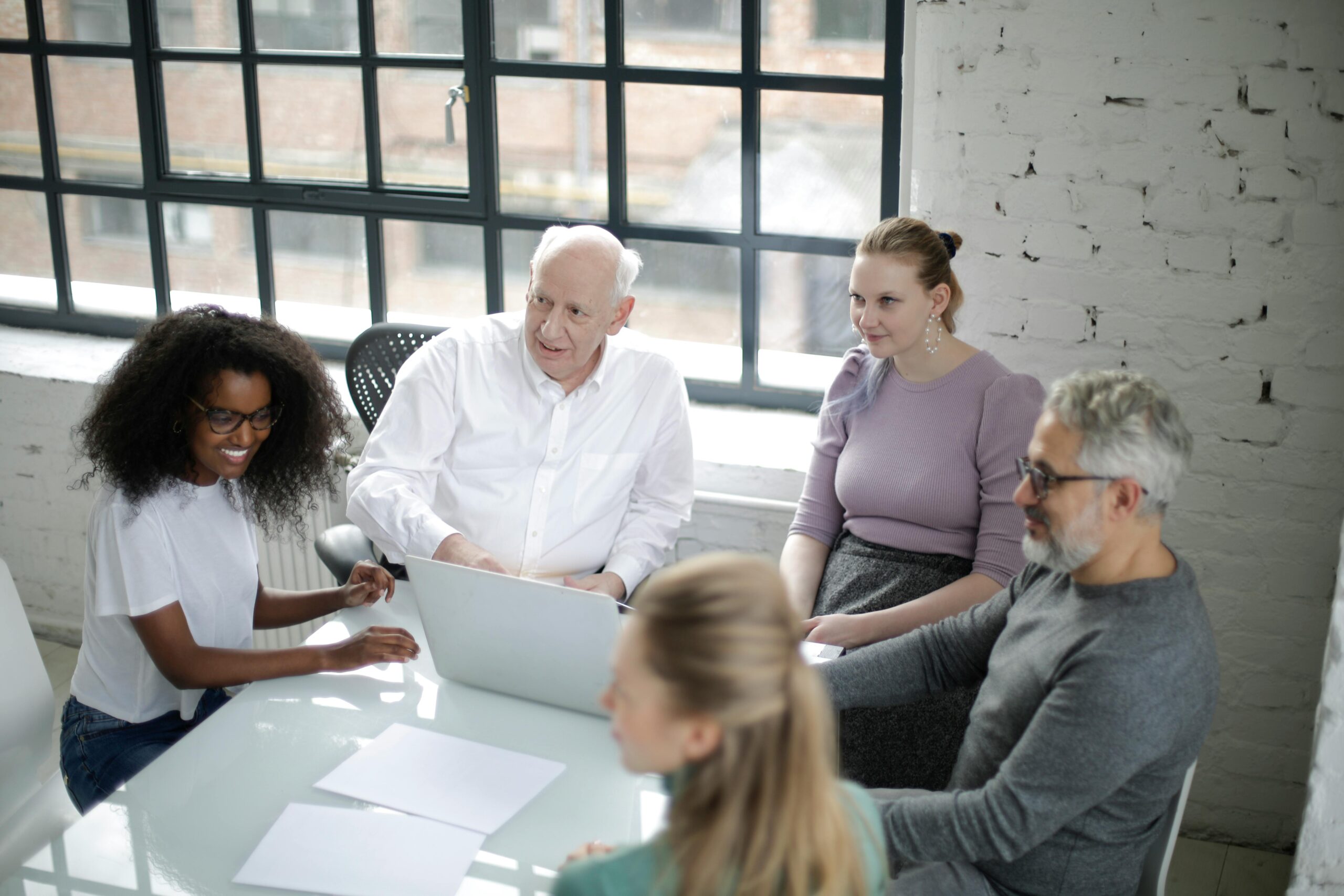 Image of people in a meeting for the blog, Having a Plan on Paper Is Not the Same as Having a Family That's Ready