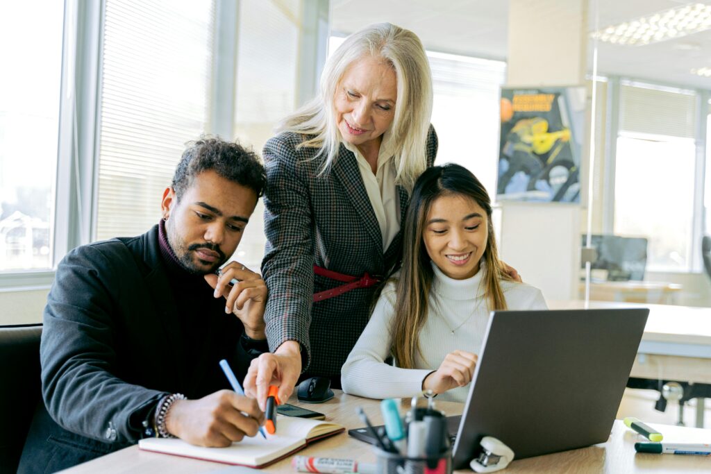 Image of people in the office for the blog, Why Legacy and Harmony Don’t Have to Be an Either-Or