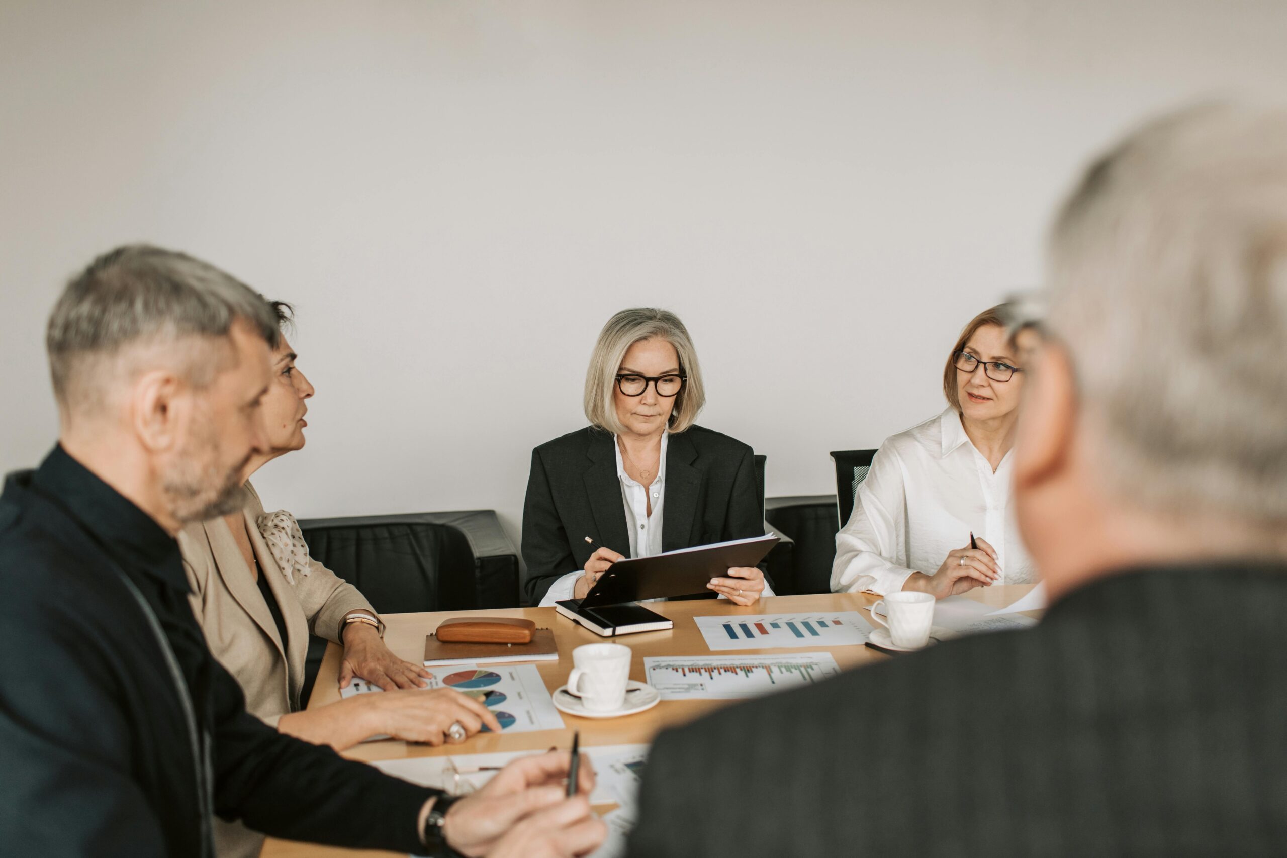 Image of people in meeting for the blog, Business Governance: The Learning Platform Your Successor Actually Needs