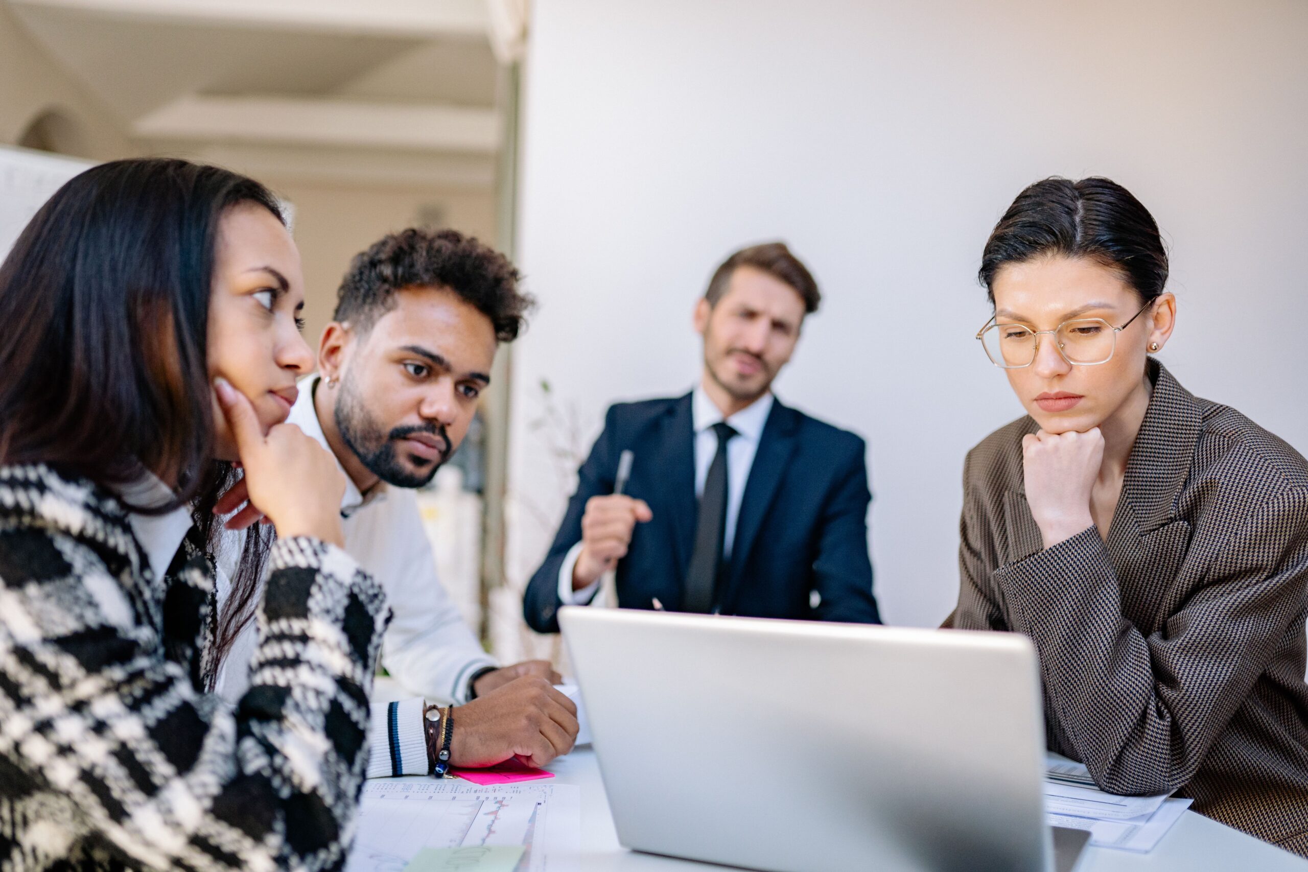 Image of people in a business meeting for the blog, How to Prepare the Next Generation for a Family Business Transition
