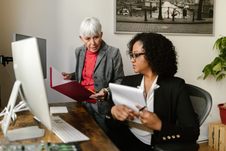 Image of an old woman and a woman talking for the blog, Family Business Succession Planning Works Best When You Build It With Your Successor
