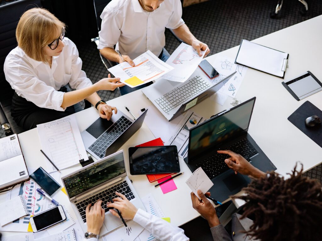 Image of people in a meeting for the blog, Why You and the People You Love End Up on Opposite Sides of the Table and What to Do About It