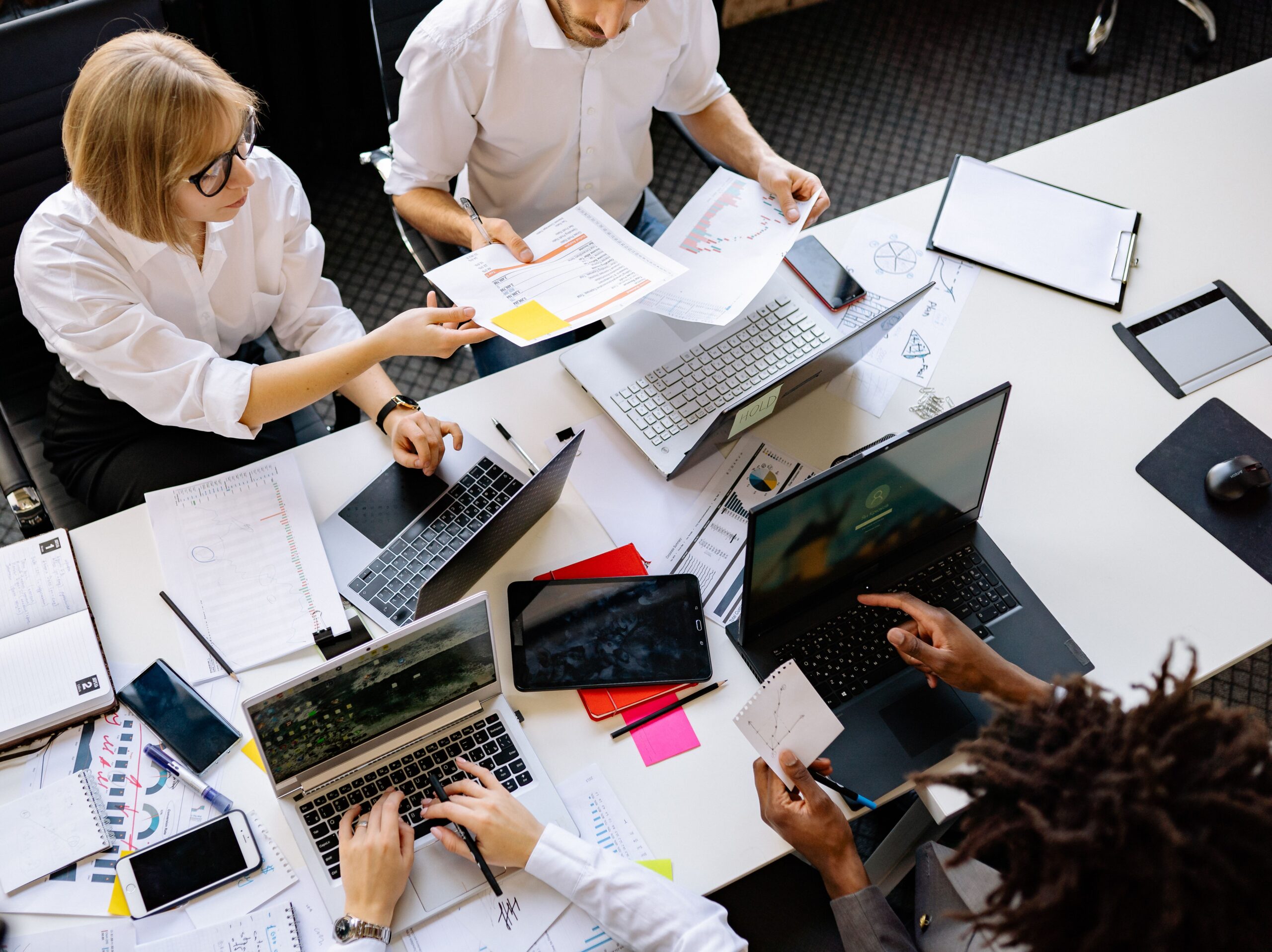 Image of people in a meeting for the blog, Why You and the People You Love End Up on Opposite Sides of the Table and What to Do About It
