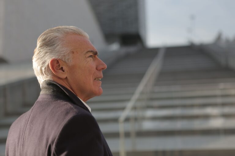 Image of man on a staircase for the blog, How to Know You Are Ready for Life After Your Business Transition